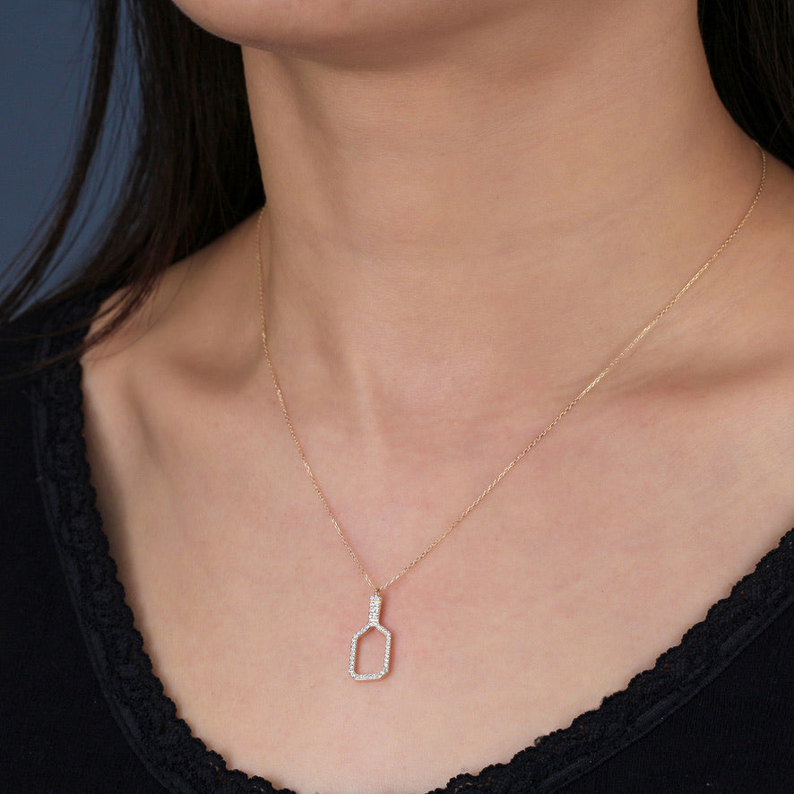 Fine Pickleball Belle Volley Necklace Solid 14k Gold with Diamonds. This stunning necklace features a diamond rimmed pickleball paddle with intricately set non-farmed diamonds for a stunning piece of jewelry!