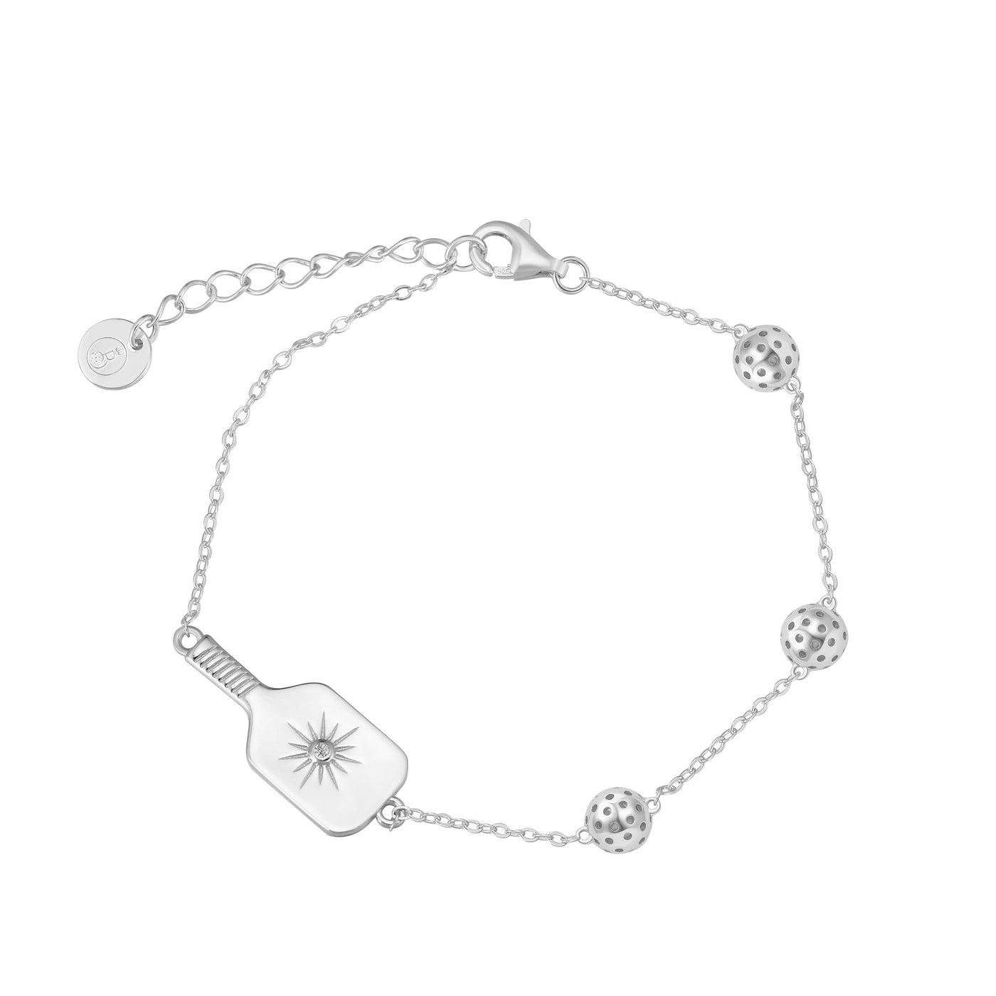 Silver Pickleball Play It Forward Bracelet featuring our "Dainty Dinker" charm front and center with three tiny pickleballs around it. Made from sustainably sourced sterling silver with a protective rhodium plating.