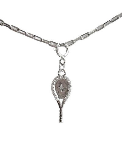 Tennis Racquet Necklace in Silver featuring a delicate tennis racquet pendant with sparkling crystal all around and an impact center stone hangs from a chic, modern paper clip style chain - 16" with a 2" extender.