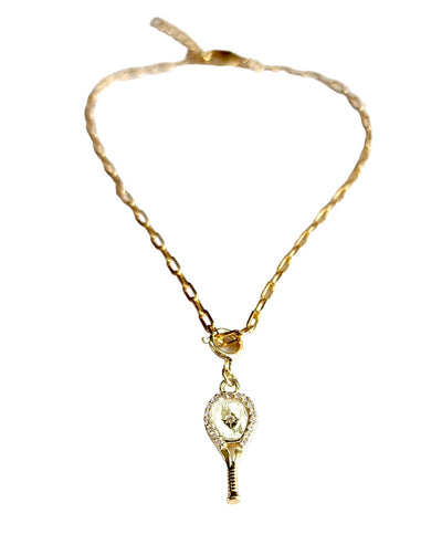 LoveMatch Tennis Racquet Charm Bracelet in Gold featuring a delicate tennis racquet pendant with sparkling crystal all around and an impact center stone hangs from a chic, modern paper clip style chain - 16" with a 2" extender.