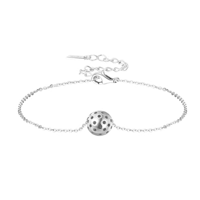 Charming Silver Baby Belle Pickleball Bracelet with Single Pickleball. This bracelet is made from sustainably sourced sterling silver. Visually accurate micro pickleball in silver, moves along our dainty 6.5" gold chain with a 2" extender.