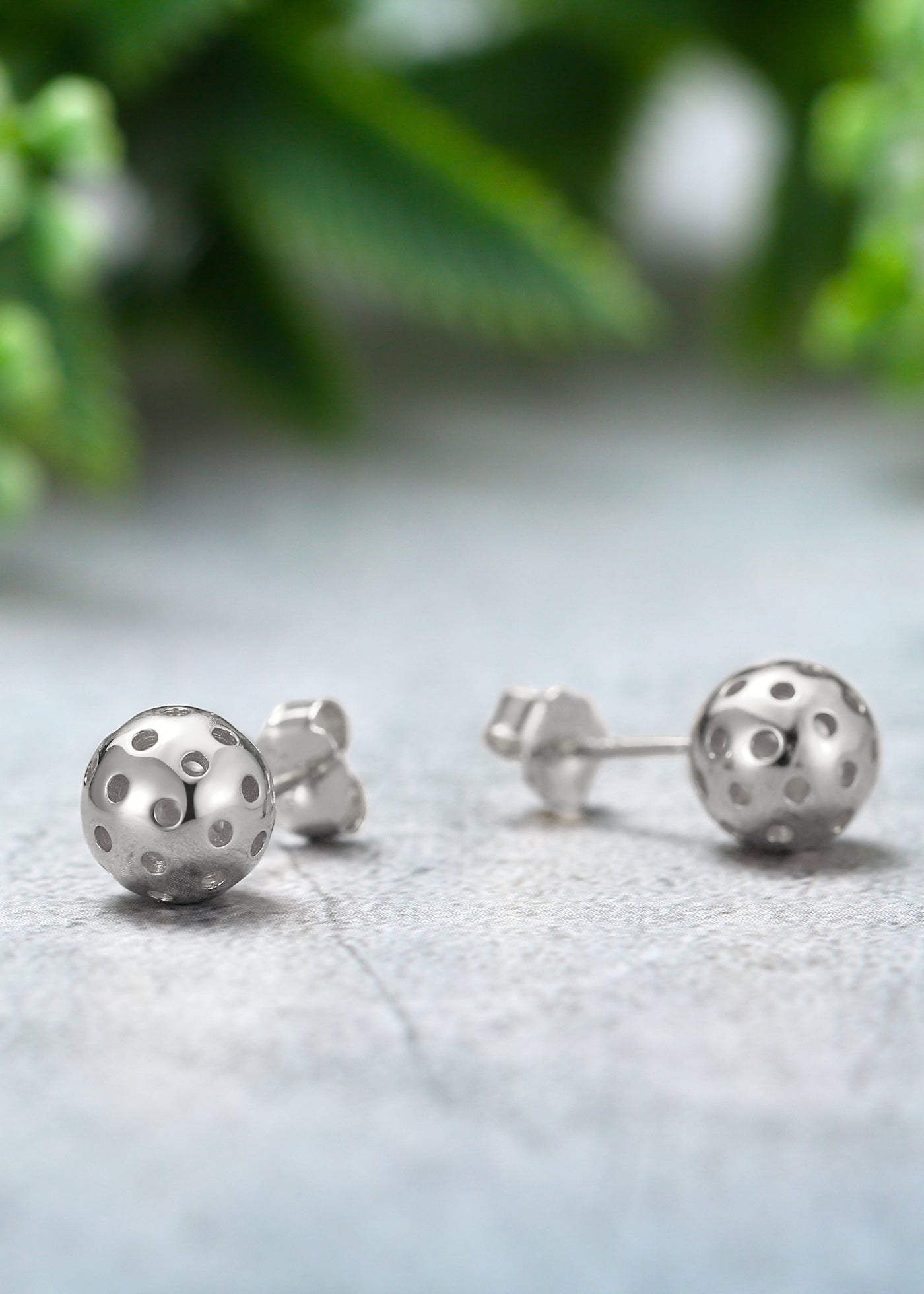 Pickleball Baby Belle Silver Ball Stud Earrings featuring an elegantly designed Pickleball in sterling silver with a protective Rhodium plating