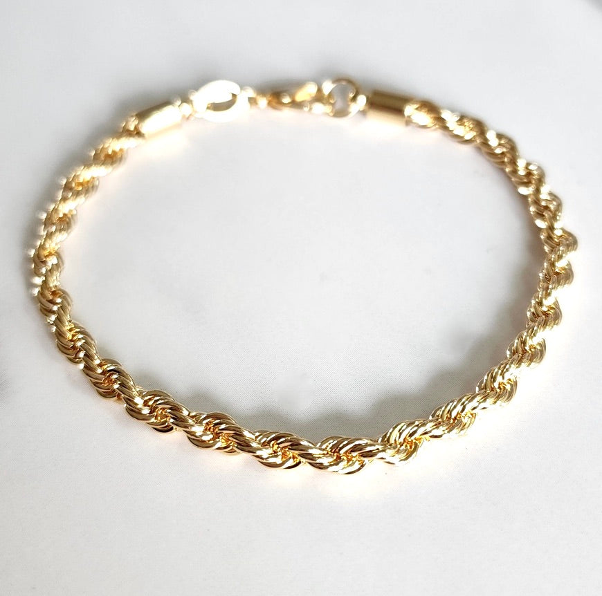 Elegant gold-filled high quality rope chain bracelet. 7" with a lobster clasp and comes with branded microsuede pouch. Wear as is or add in any of our themed charms for added wow factor.