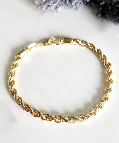 Elegant gold-filled high quality rope chain bracelet. 7" with a lobster clasp and comes with branded microsuede pouch. Wear as is or add in any of our themed charms for added wow factor.