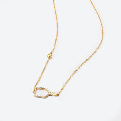 Pickleball Bella Bling Gold Necklace. Made from 18k gold plated over sterling silver with top quality CZ stones set around the paddle. The pickleball charm sits further up the necklace. We have added a delicate chain for elegance, and have added 2" of extender chain so you can wear this between 15" and 17".