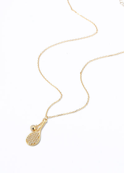 LoveMatch Gold Tennis LOVE PLUS Dainty Necklace featuring a detailed tennis racket, then added a tennis ball on a chain to 'swing' with every step, added some sparkling crystals for extra bling!