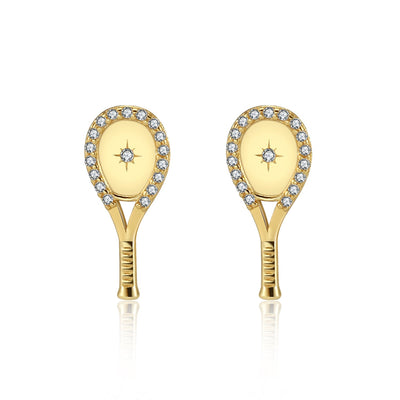 Tennis Racquet Plus Stud Earrings in Gold by LoveMatch. These tennis earrings feature A classic racquet shape with a set crystal and impact starburst design in the center, and framed with delicate top-quality CZ crystals. 15mm long.