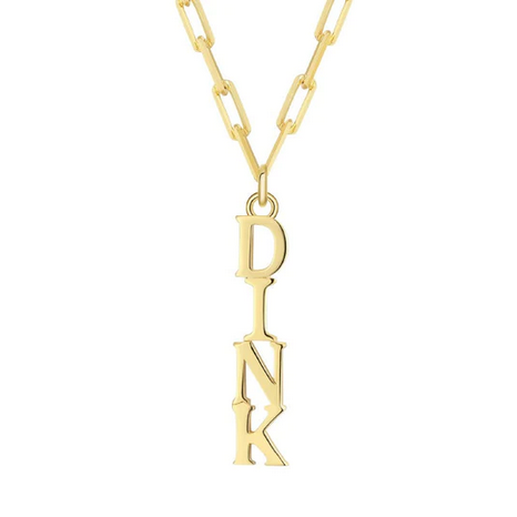 Pickleball Dinks on Me Necklace in Gold. Made from sustainably sourced Sterling Silver with a 14k gold overlay. Comes on a delicate but sturdy clip chain that adds a touch of contemporary style.DINK spelled out in a line make a whimsical pendant off our clip chain necklace that can adjust from 16.5 - 18.