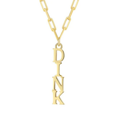 Pickleball Dinks on Me Necklace in Gold. Made from sustainably sourced Sterling Silver with a 14k gold overlay. Comes on a delicate but sturdy clip chain that adds a touch of contemporary style.DINK spelled out in a line make a whimsical pendant off our clip chain necklace that can adjust from 16.5 - 18.