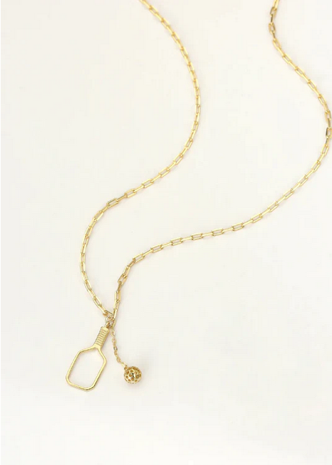 Pickleball The Mini Volley Necklace Gold. A delicate but perfect 18mm paddle pendant with a swinging pickleball charm suspends off of a dainty clip chain. This can be worn as a choker at 15” and can extend to 17”.Made from sustainably sourced Sterling Silver with a thick 14k &amp; gold overlay, comes on a delicate but sturdy clip chain that adds a touch of contemporary style.